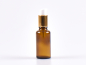 Preview: lotionsflasche-braunglas-pumpe-gold-30ml