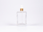 Preview: Klarglasflasche Miro 100ml - Pipette gold