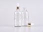 Preview: Klarglasflasche 100ml, mit Pipette gold