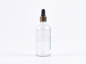 Preview: Klarglasflasche 100ml, mit Pipette gold
