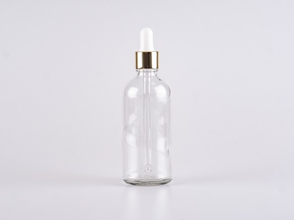 Klarglasflasche 100ml, mit Pipette gold