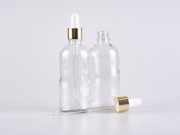 Klarglasflasche 100ml, mit Pipette gold