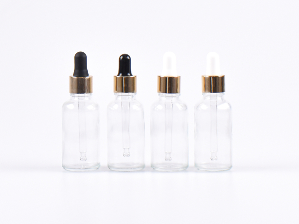 Klarglasflasche 100ml, mit Pipette gold