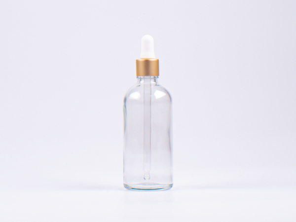 Klarglasflasche 100ml, mit Pipette gold