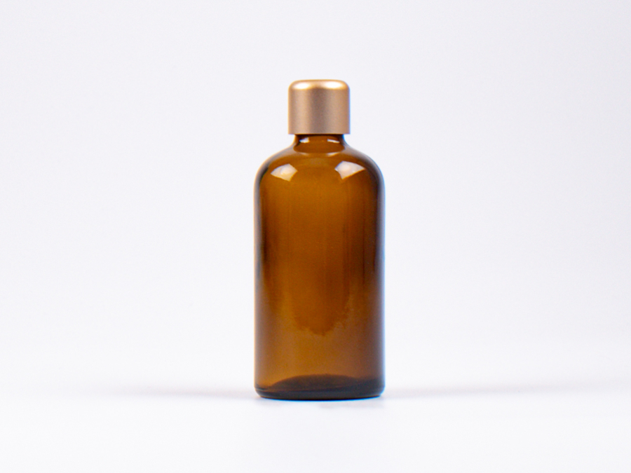 Braunglasflasche 100ml, mit Tropfmontur Gold