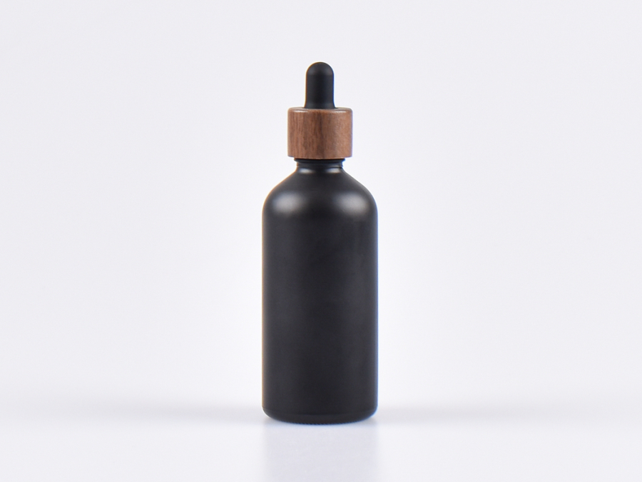 glasflasche-schwarz-pipette-holz-montur