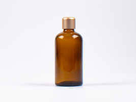 Braunglasflasche 100ml, mit Tropfmontur Gold
